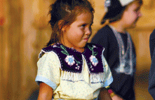 Photo of American Indian girl in tribal dress.