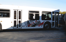 Photo of a bus that displays an ad for the Austin, Texas, Basta Ya! victim awareness campaign.
