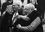 Photograph of Suse Lowenstein and Peter Tsairis, and his wife Aphrodite Tsairis, being hugged by Peter Lowenstein, after announcement of the verdict of the Pan Am 103 trial. The Lowensteins’ son Alexander (21) and the Tsairis’ daughter Alexia (20) were both victims.